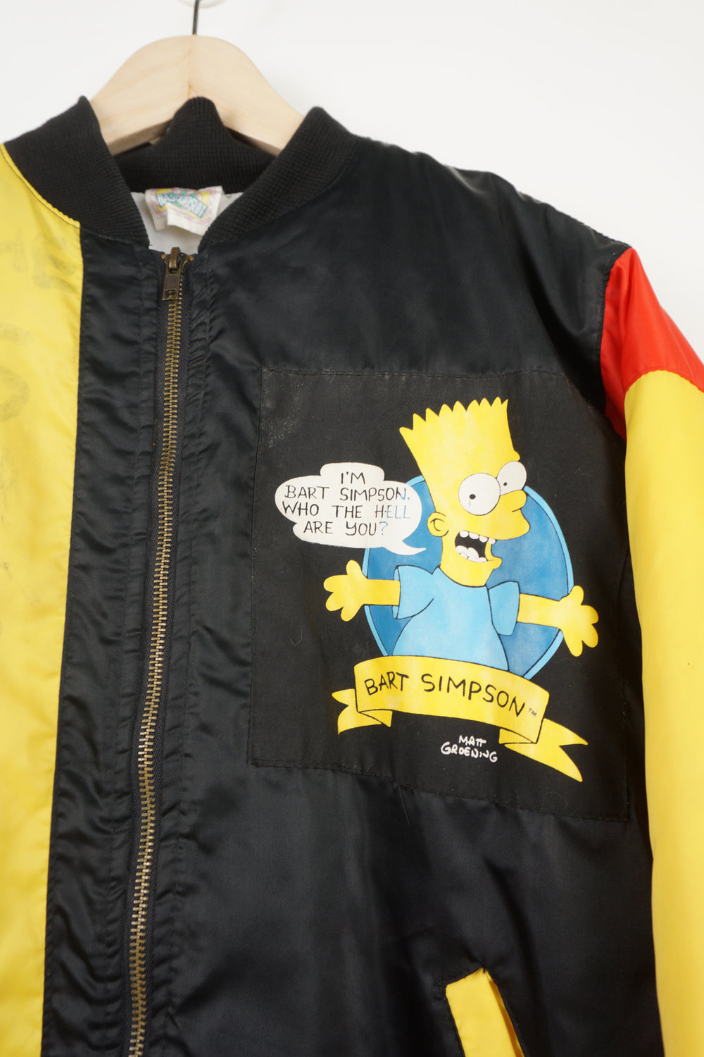 Vintage 90's The Simpsons theme child's bomber jacket with Bart Simpson graphics on the front and back