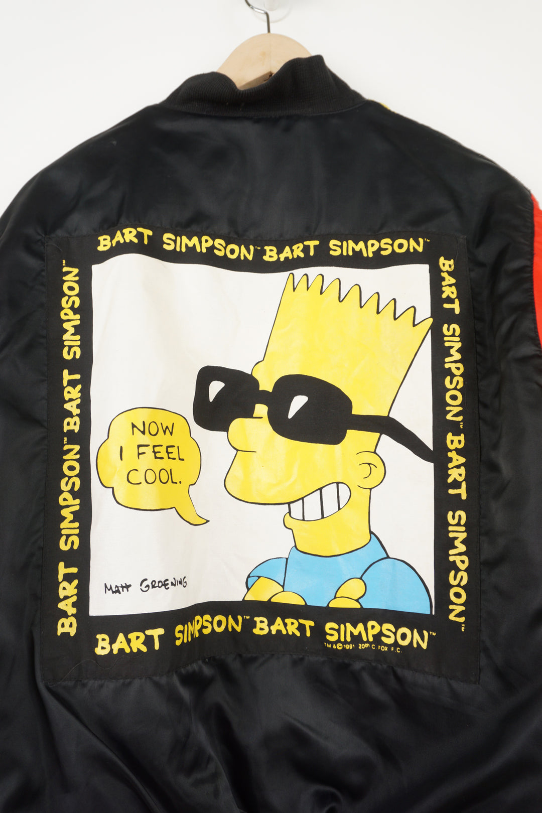 Vintage 90's The Simpsons theme child's bomber jacket with Bart Simpson graphics on the front and back