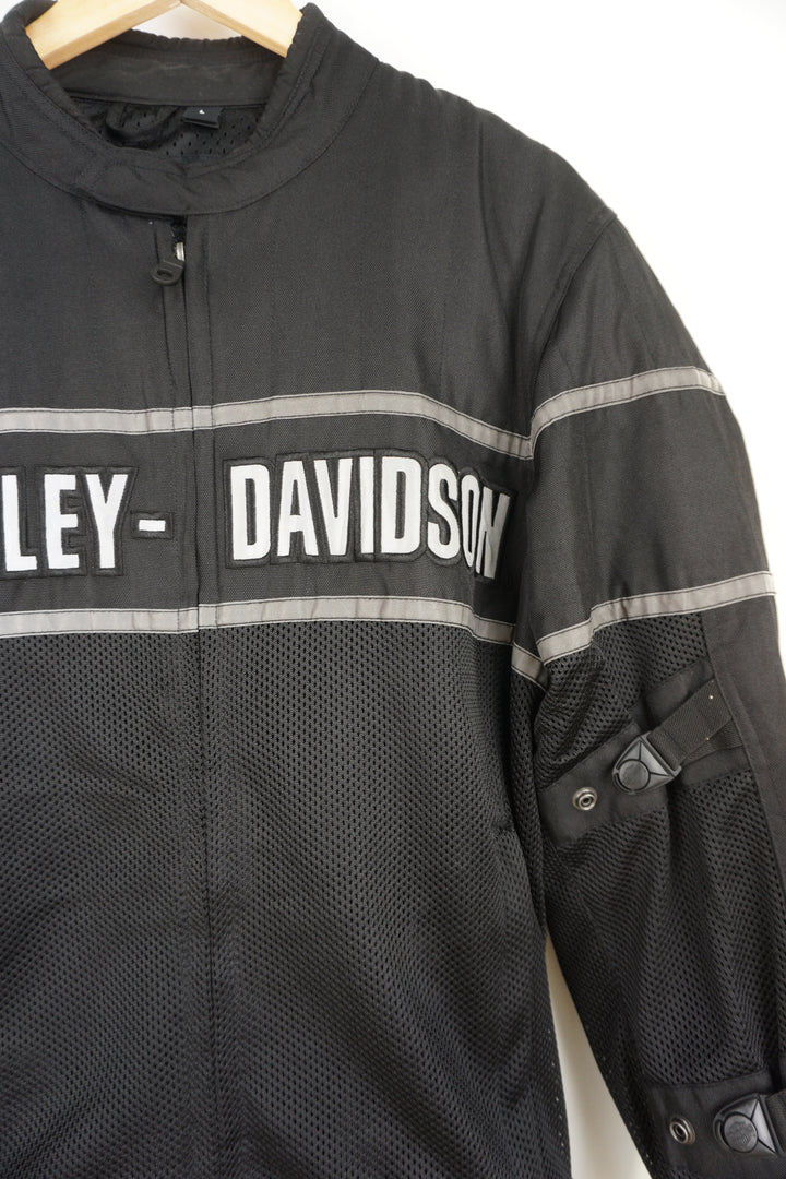 Harley Davidson classic cruiser black mesh riding jacket with removable pads in the shoulder and elbows. With embroidered spell-out details across the chest and on the back