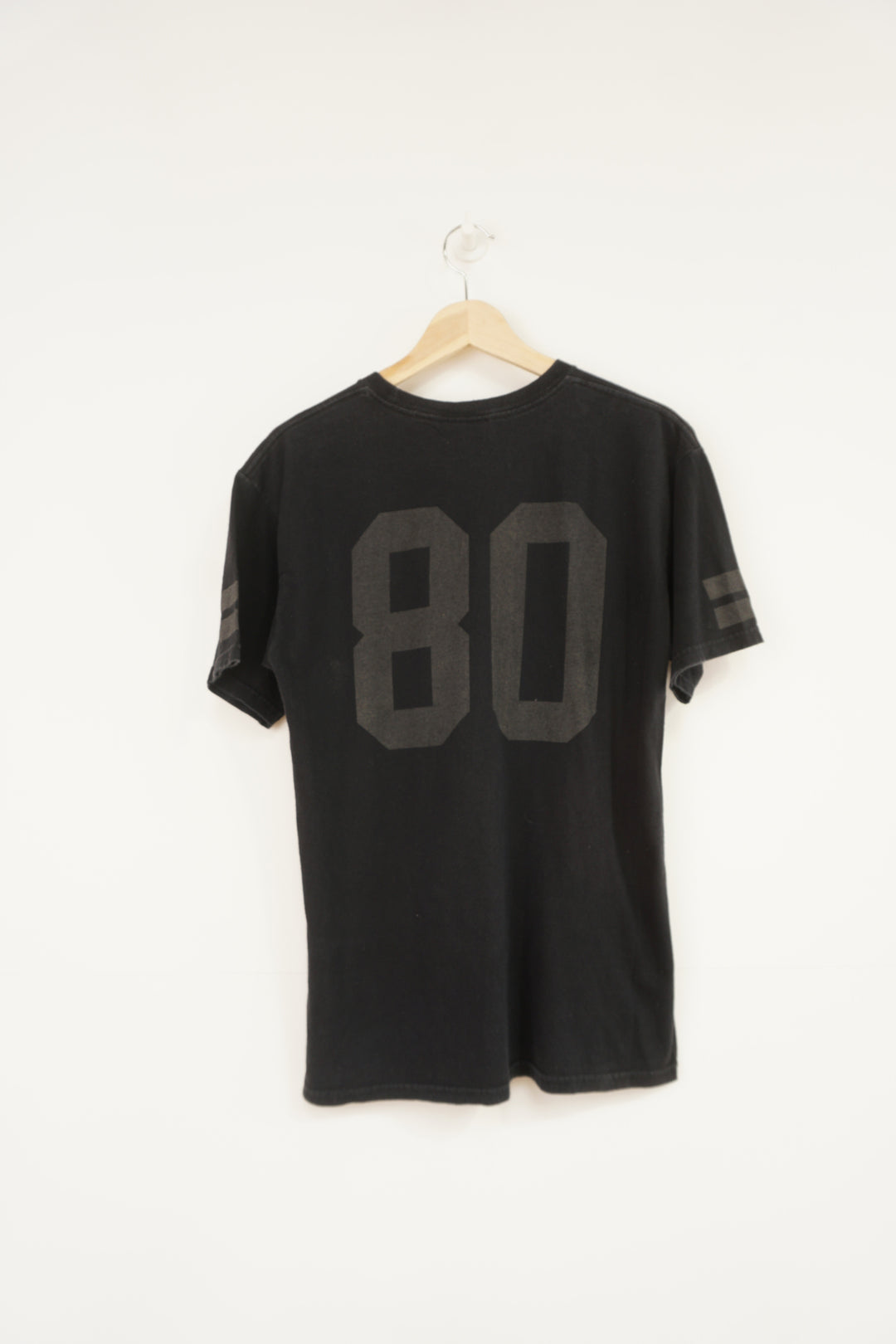 Vintage Stussy black t-shirt, with spell-out graphic on the front and back