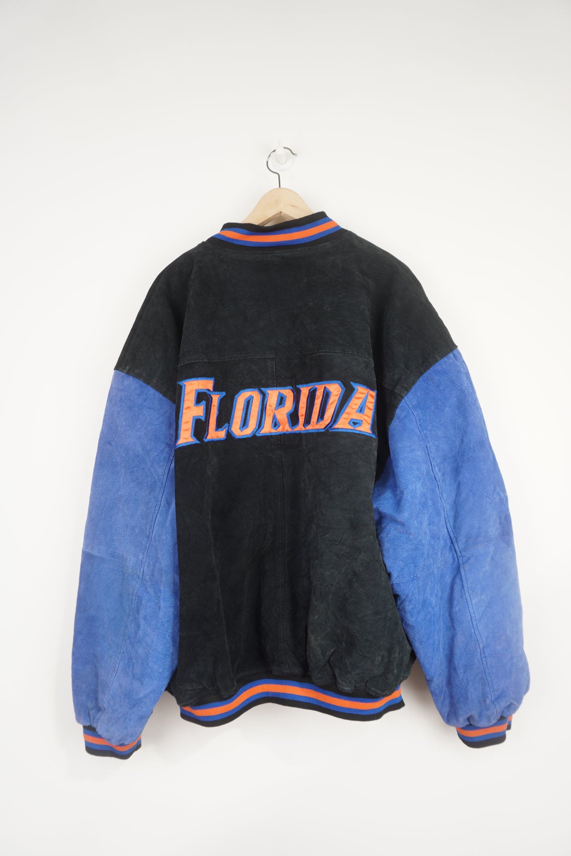 Vintage Florida Gators black and blue suede bomber jacket with embroidered badge and spell-out details