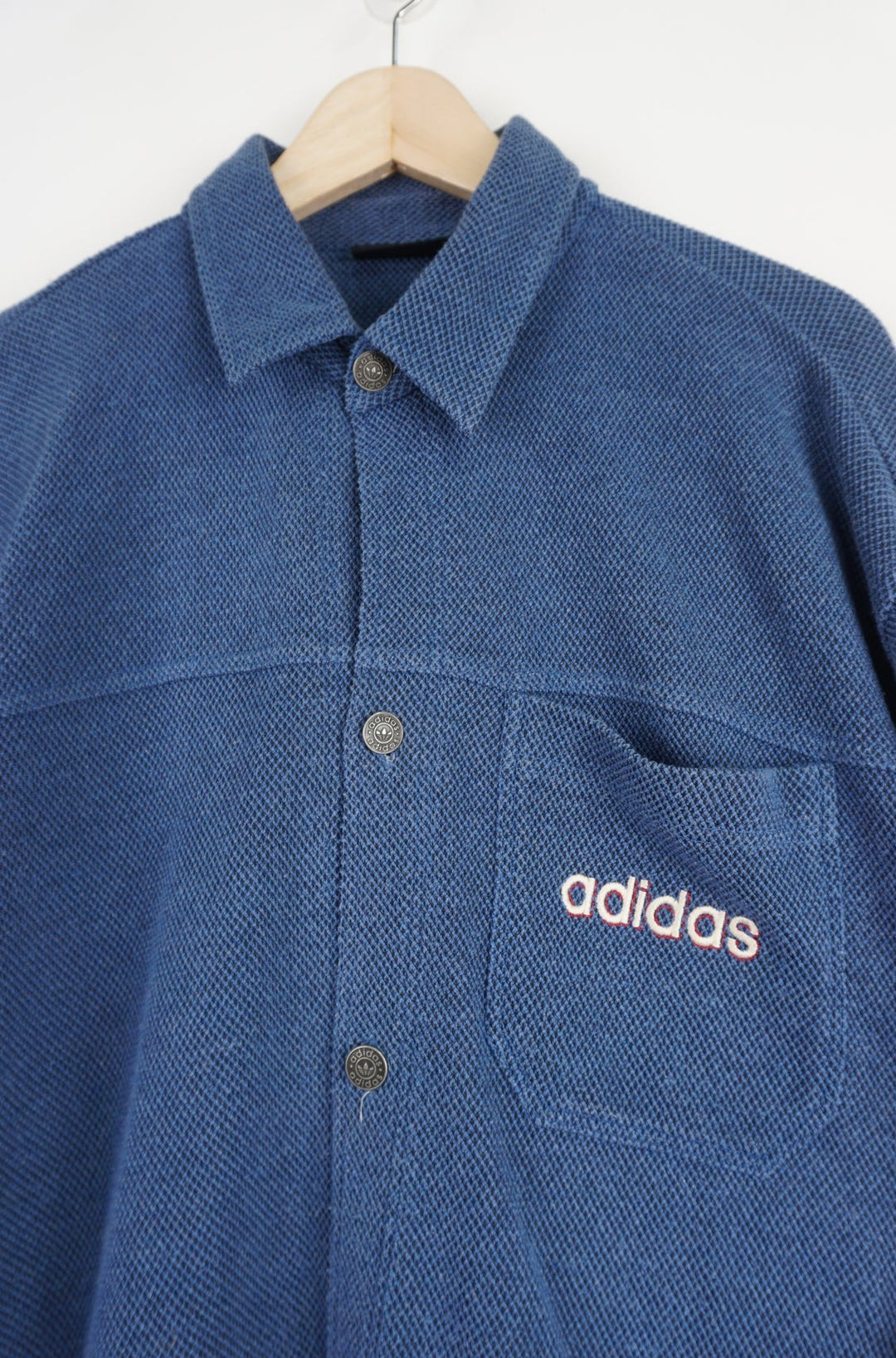 Vintage navy blue  Adidas waffled textured long sleeve button up shirt with embroidered logo on the chest pocket