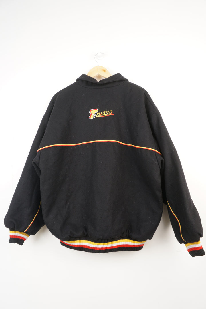 Vintage black TT wool bomber jacket with embroidered isle of man 2000 road races logo on the chest and T 2000 on back. Closes with a zip.