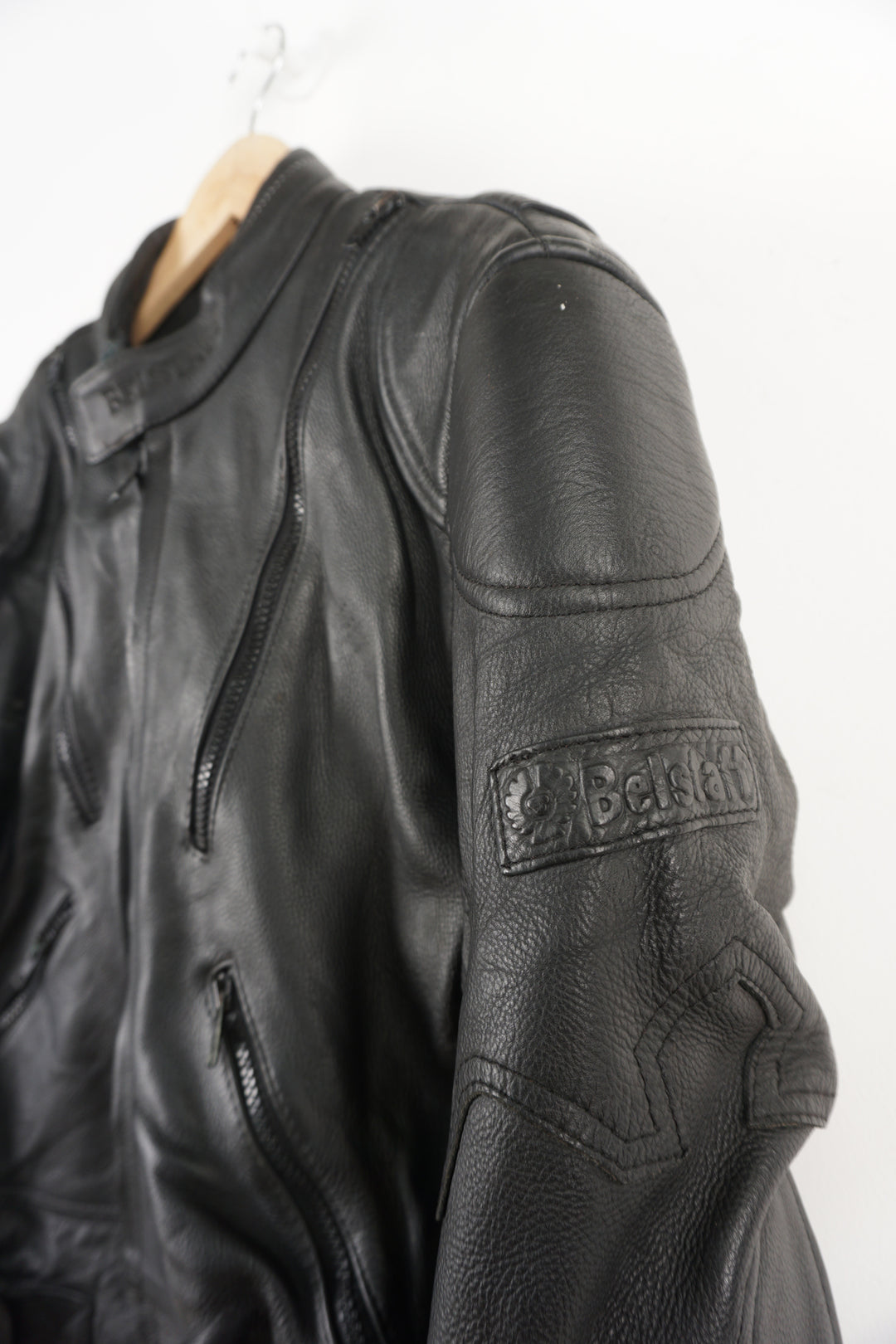 Belstaff Biker Motorcycle Jacket crafted from high quality black leather, it features embroidered Belstaff logos on both arms and classic black hardware. It has reliable zip and Velcro closure, as well as shoulder and elbow pads