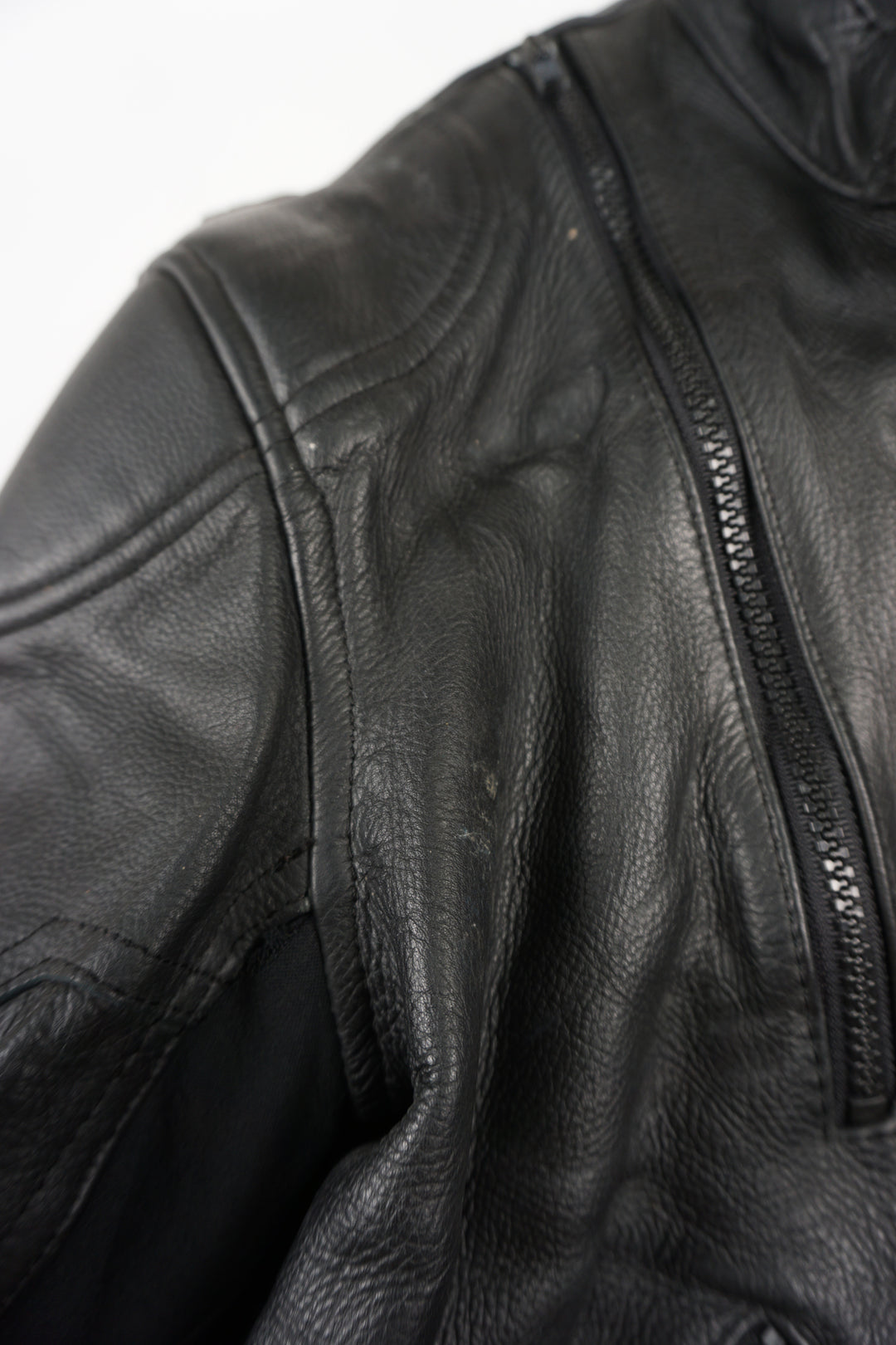 Belstaff Biker Motorcycle Jacket crafted from high quality black leather, it features embroidered Belstaff logos on both arms and classic black hardware. It has reliable zip and Velcro closure, as well as shoulder and elbow pads