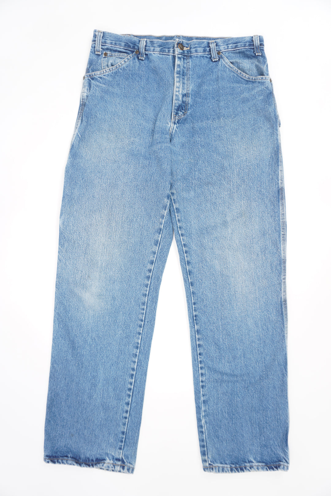 Dickies blue carpenter jeans with multiple pockets and signature logo on the back pocket