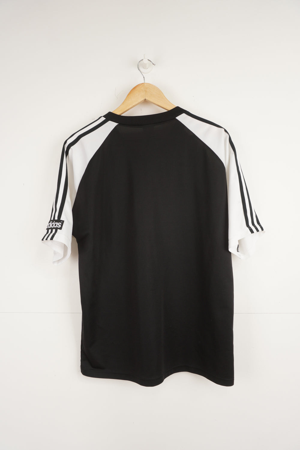 Vintage 90's Adidas v-neck black and white football top with raised logo on chest