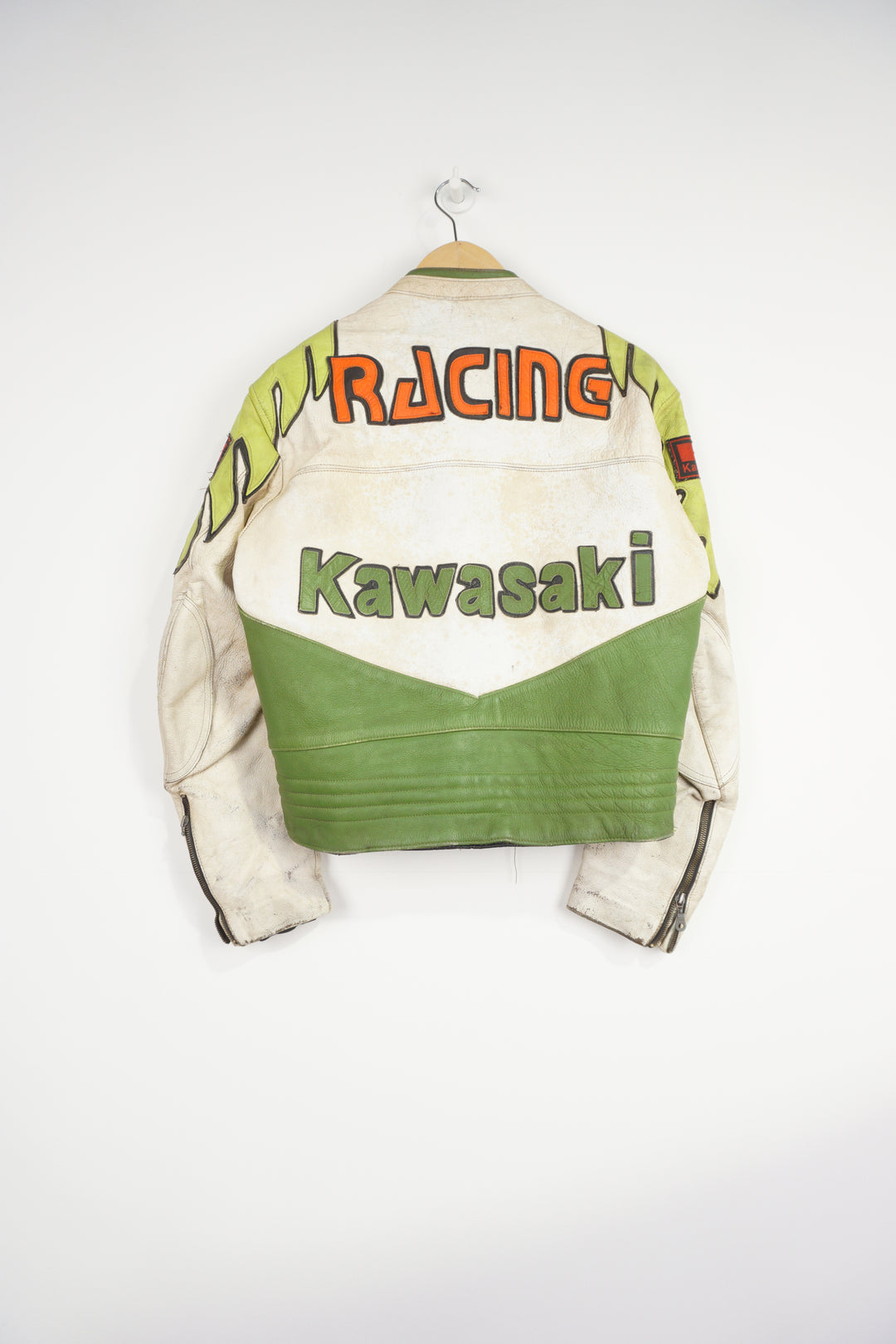 Vintage Kawasaki green & white leather motorcycle jacket features embroidered spell-out details, badges and sponsors