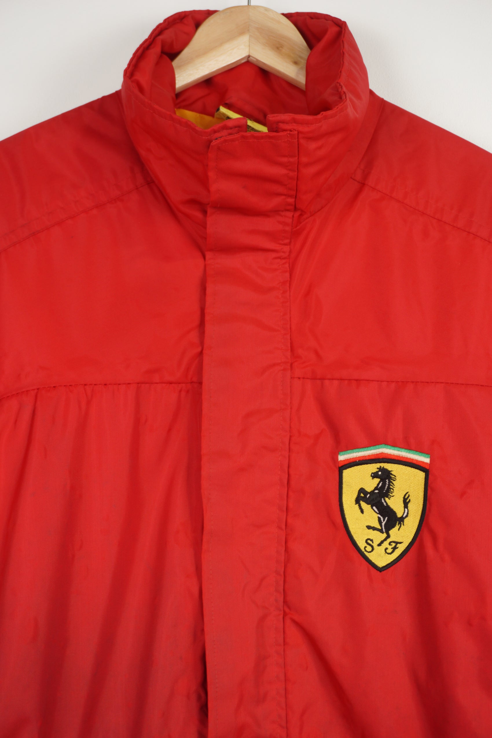 Rare vintage 1995 all red Ferrari zip through padded coat, features embroidered badge on the chest and collar