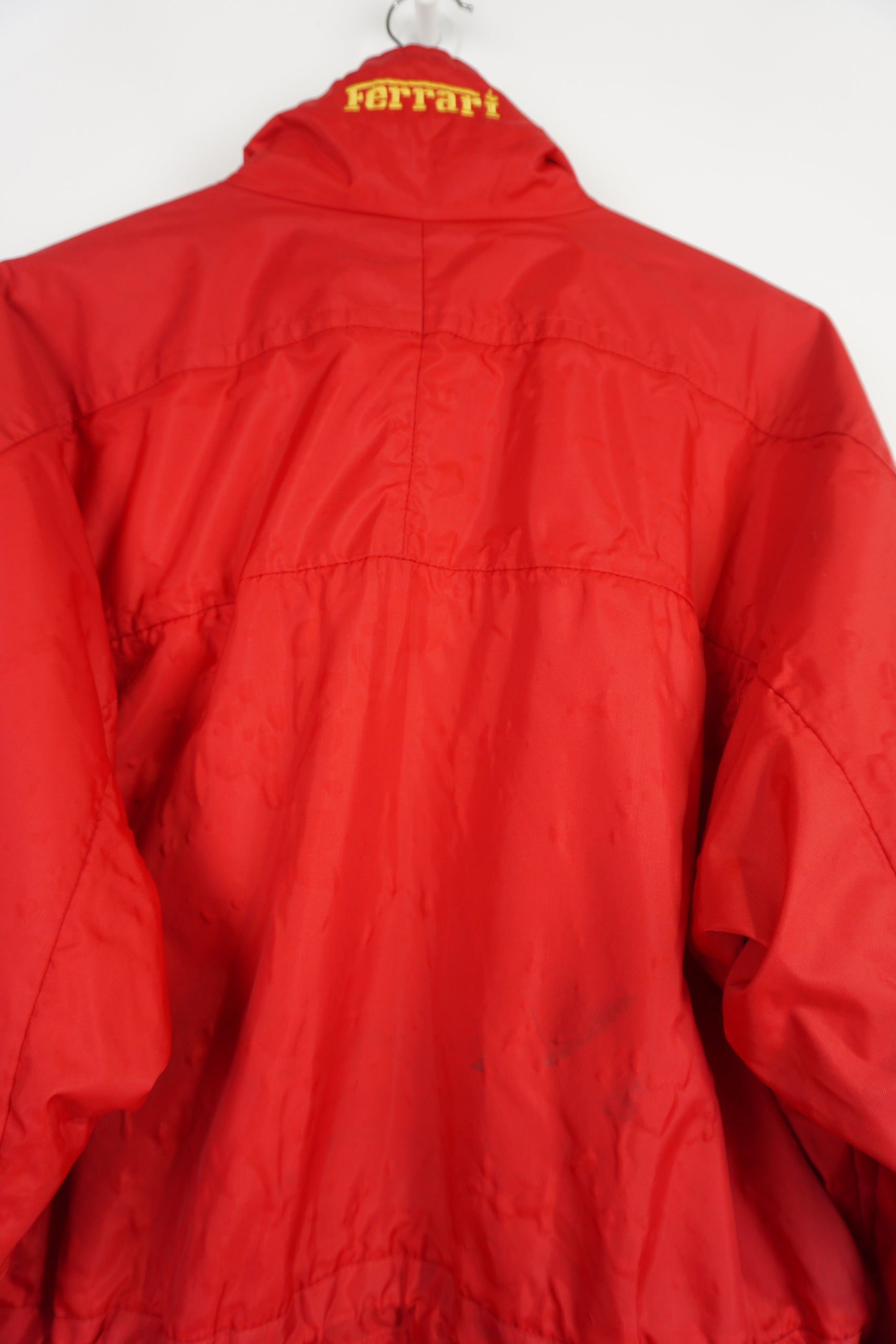 Rare vintage 1995 all red Ferrari zip through padded coat, features embroidered badge on the chest and collar