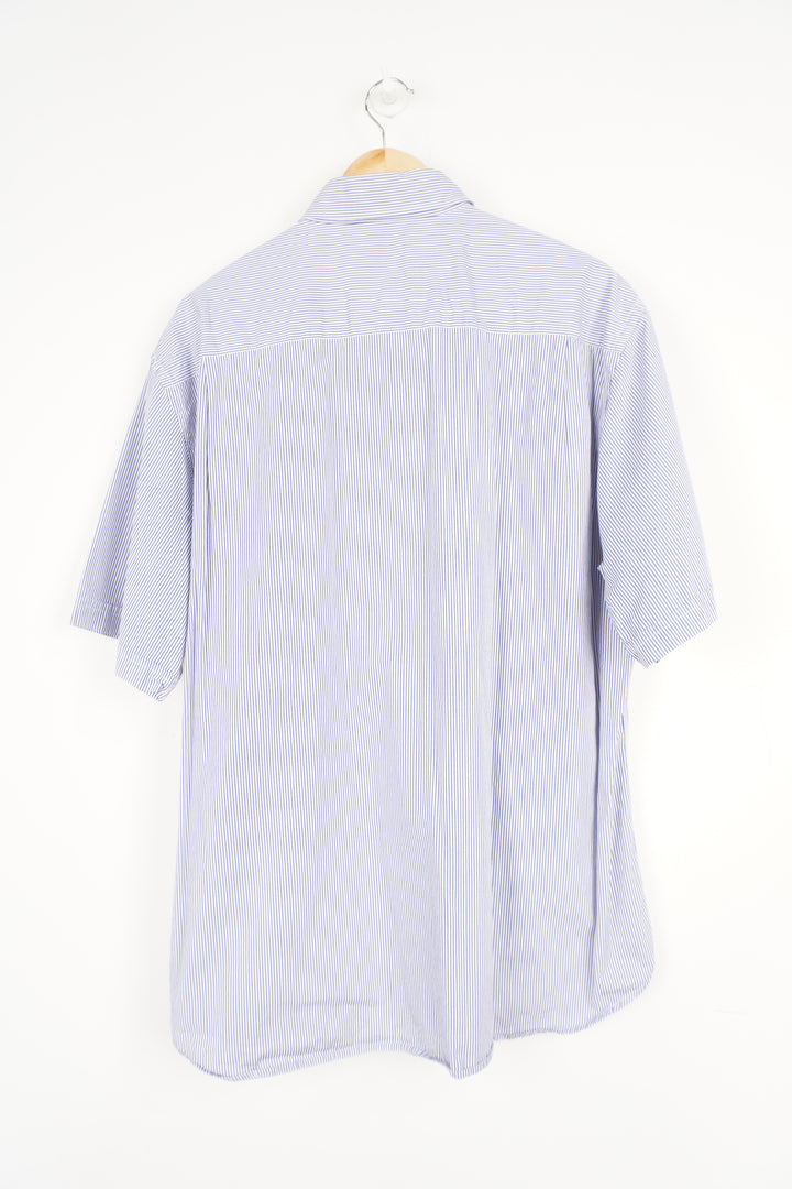 White and blue vertical striped shirt with embroidered Paul & Shark logo on the pocket