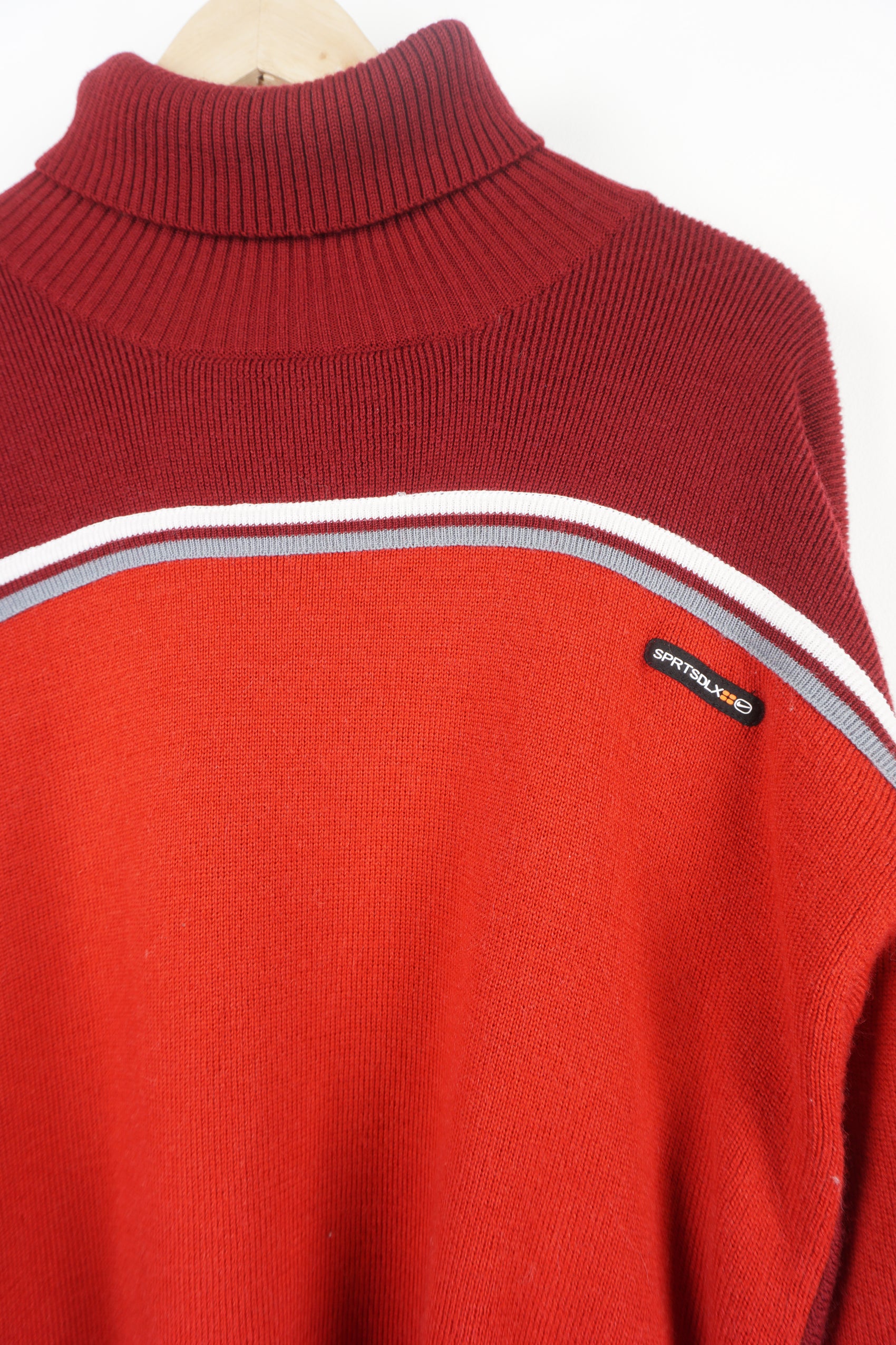 Nike SPRTSDLX red knitted jumper features raised logo on the chest