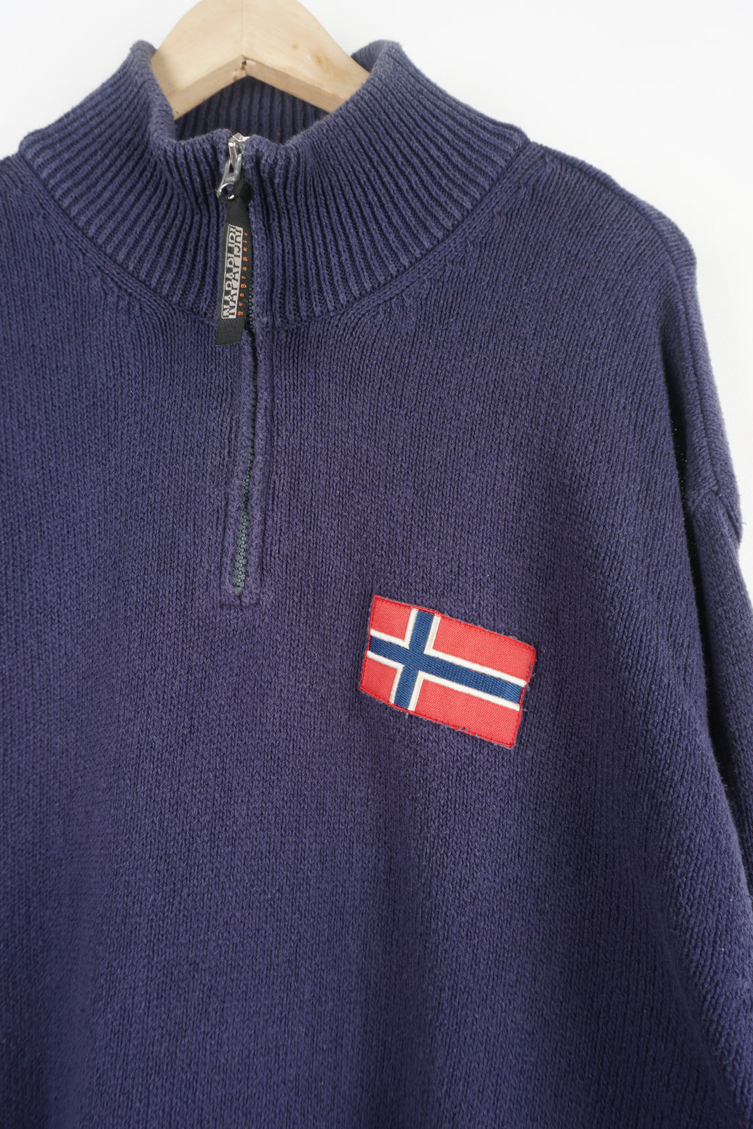 Napapijri navy blue high neck 1/4 zip knitted jumper, features embroidered logo on the chest and sleeve