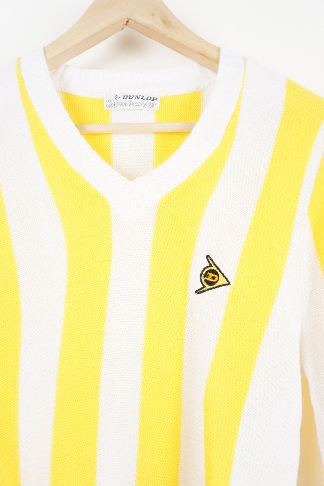 Vintage 80's Made in England Dunlop yellow and white striped, knitted jumper features embroidered logo on the chest