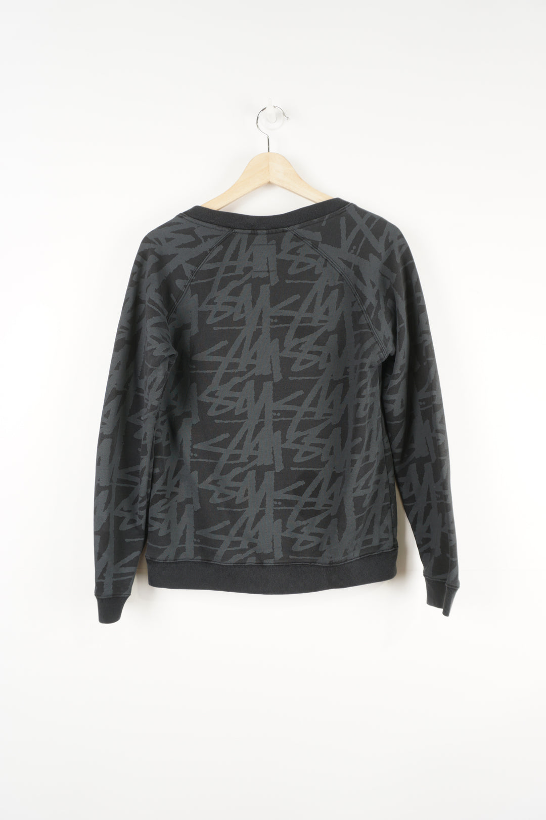 Stussy black v-neck sweatshirt with spell-out graphic all over