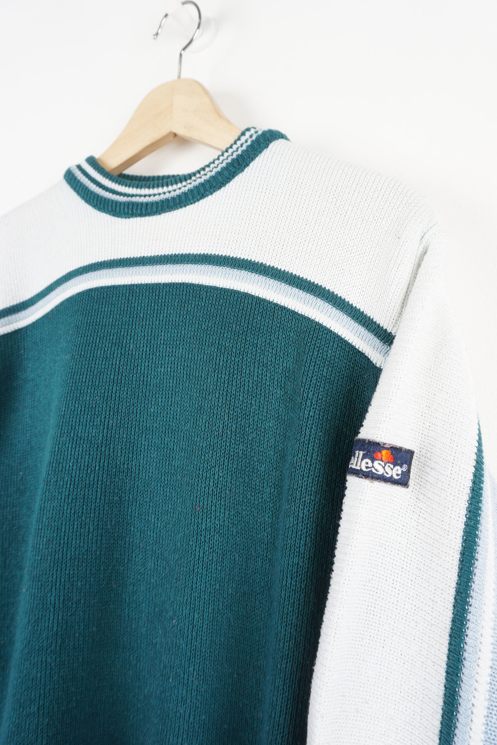 Vintage Ellesse teal blue and white knitted jumper, features  embroidered spell-out logo on the sleeve