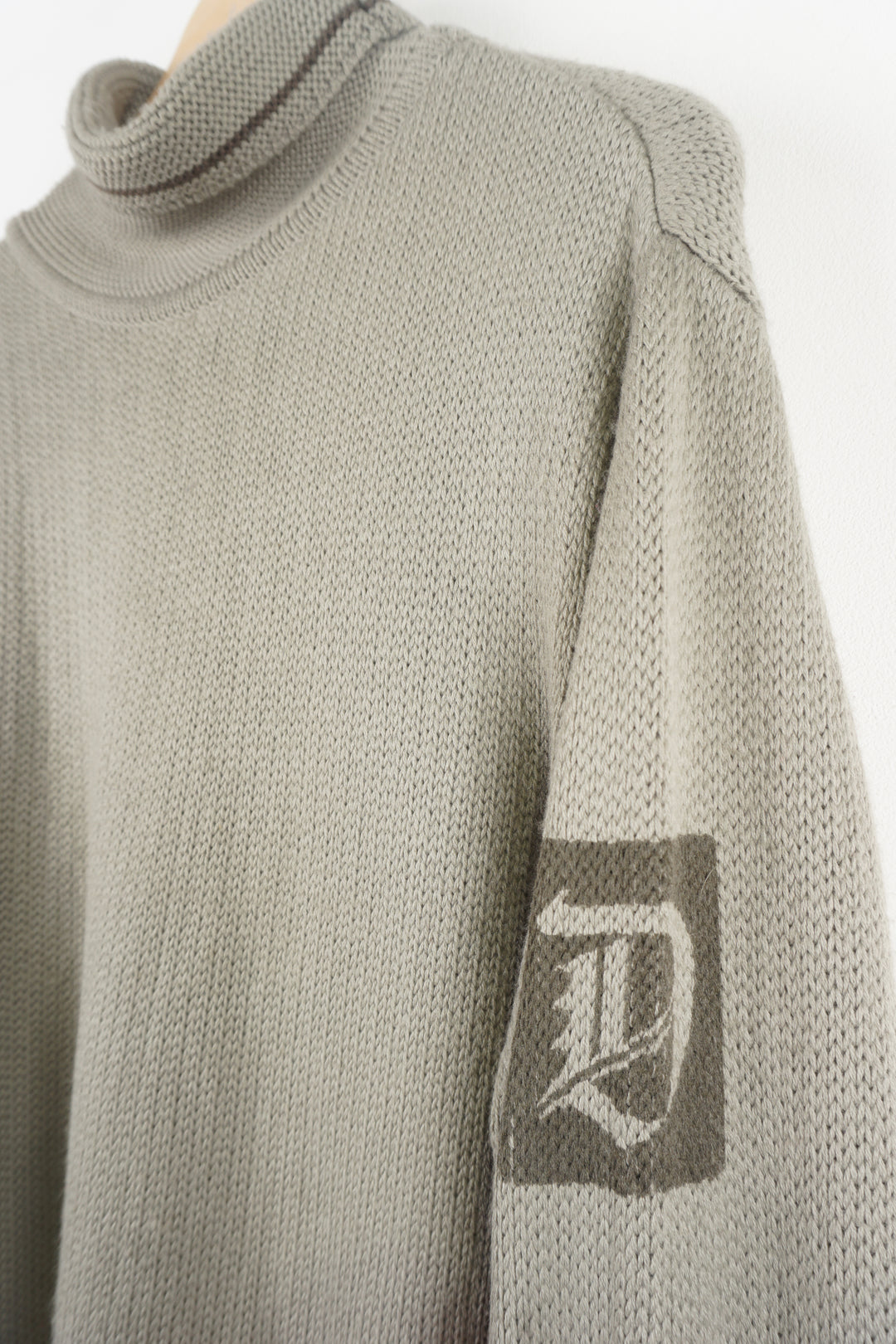 Diesel khaki green roll neck knitted jumper features signature logo on the shoulder 