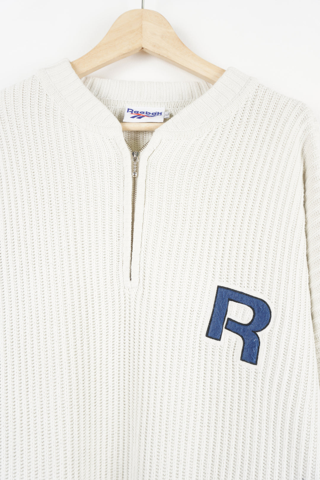 Reebok 1/4 zip v-neck cotton knit jumper features embroidered logo on the chest and spell-out details on the back