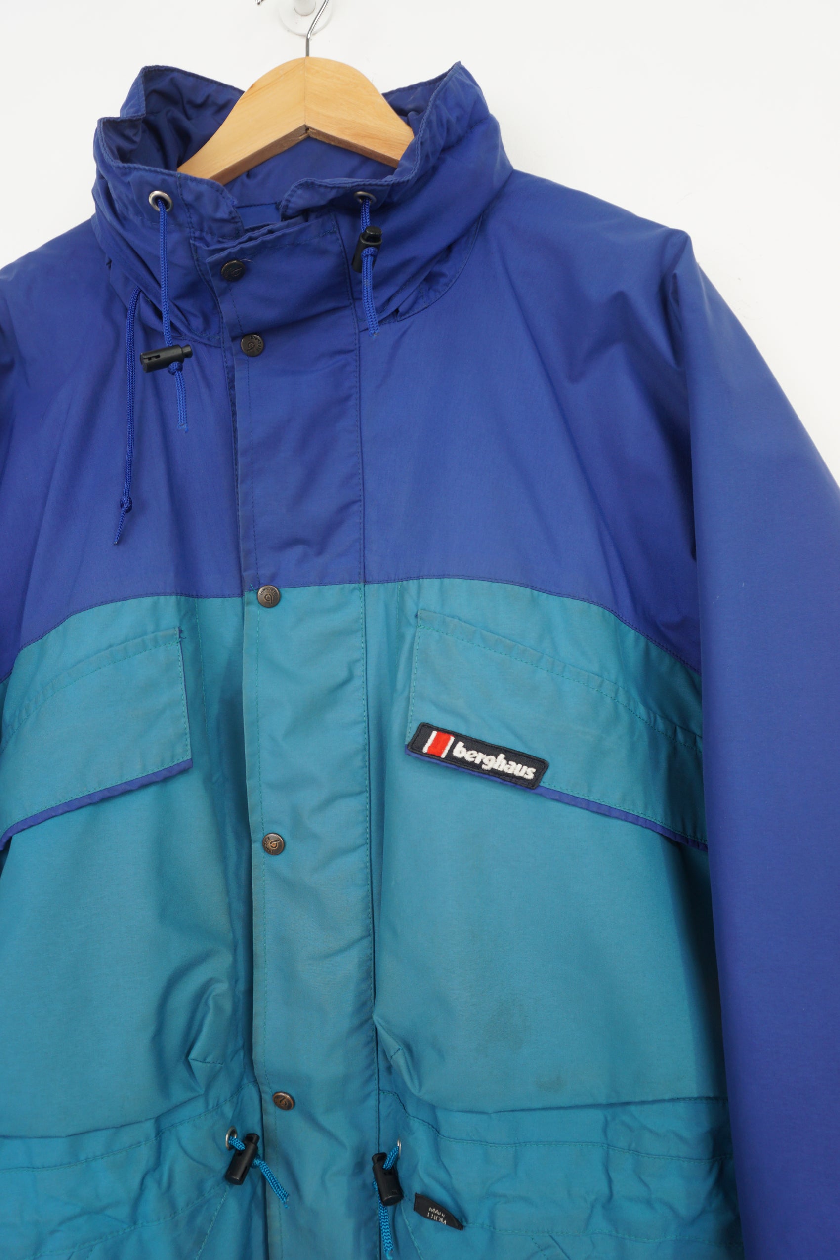 Berghaus blue gore-tex fabric Windbreaker jacket with foldaway hood and logo