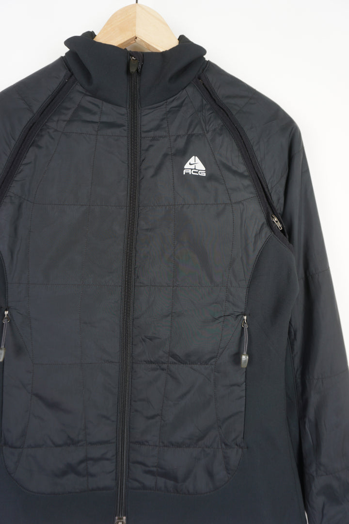 Women's Nike ACG zip through black lightly padded convertible jacket, features zip off sleeves so it can be worn as a gilet