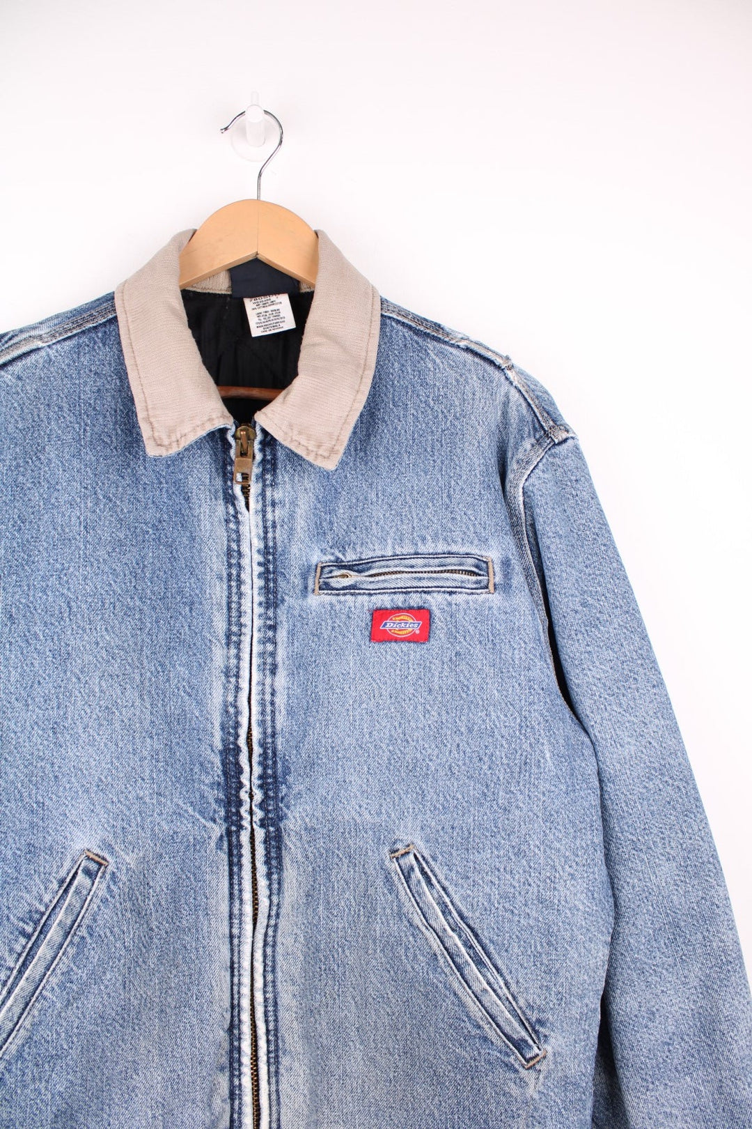 Dickies Denim Jacket in a light blue denim stonewash colourway with a beige corduroy collar, zip up with multiple pockets, has a quilted lining, and the logo embroidered on the front.