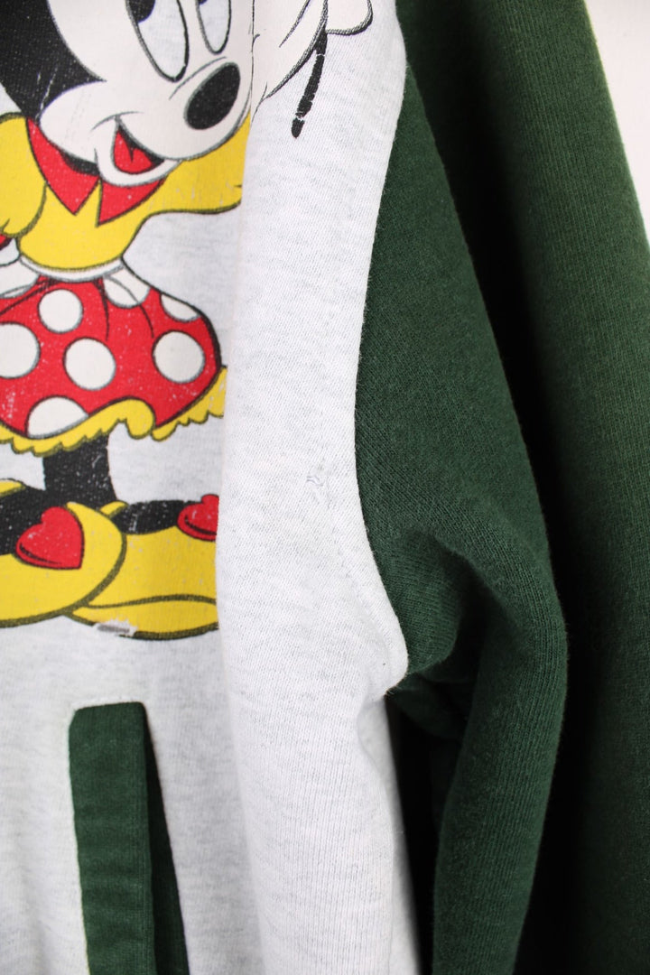 Vintage Disney Minnie Mouse Cotton Varsity Jacket in a grey and green colourway, button up with side pockets, has a nylon lining, and Minnie Mouse printed on the front. 