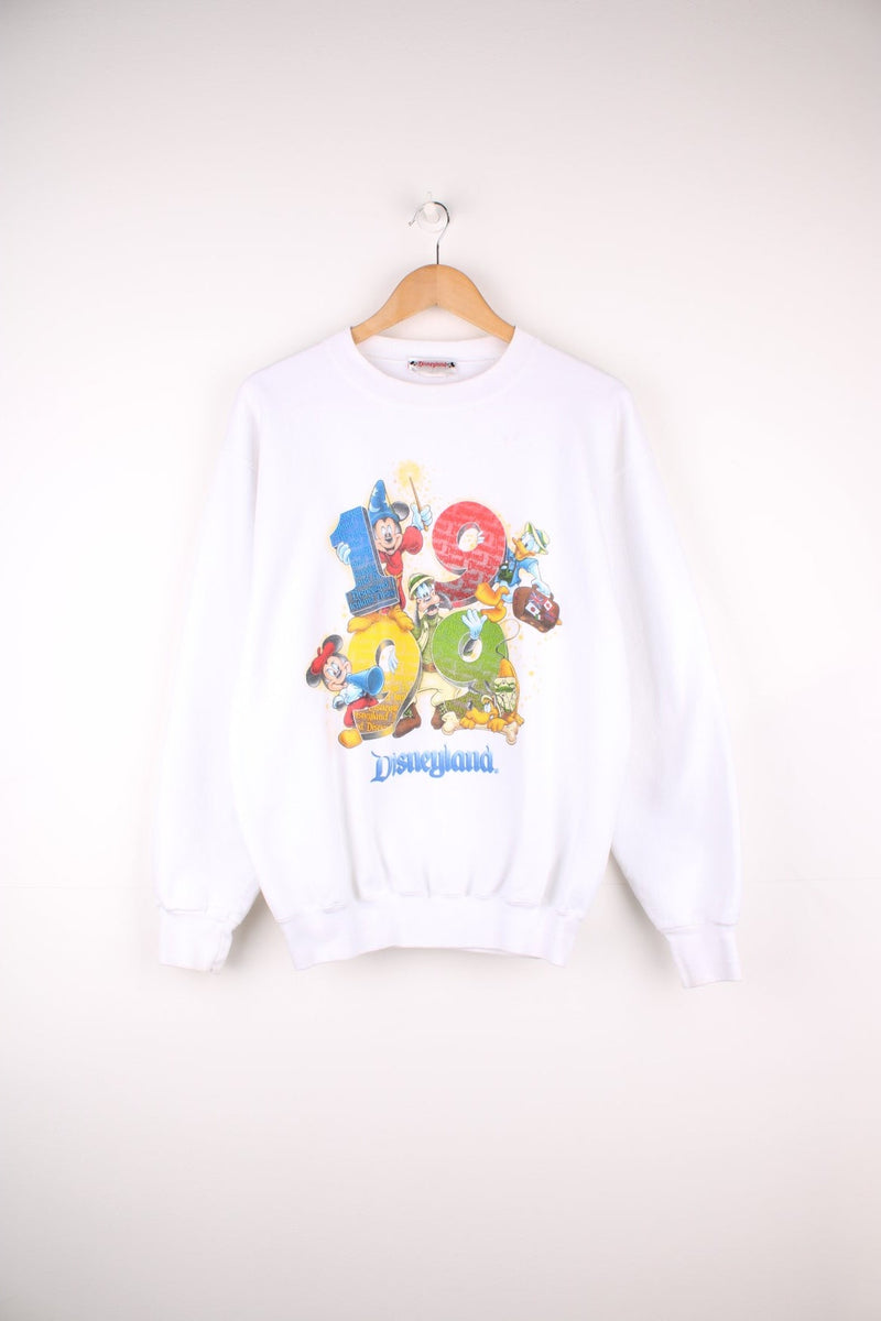 1999 Disneyland Sweatshirt in a white colourway with the characters and 1999 spell out printed on the front. 