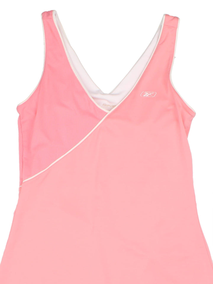 Vintage Reebok Tennis Dress in pink colourway with white piping, mesh detail and logo printed on the front.