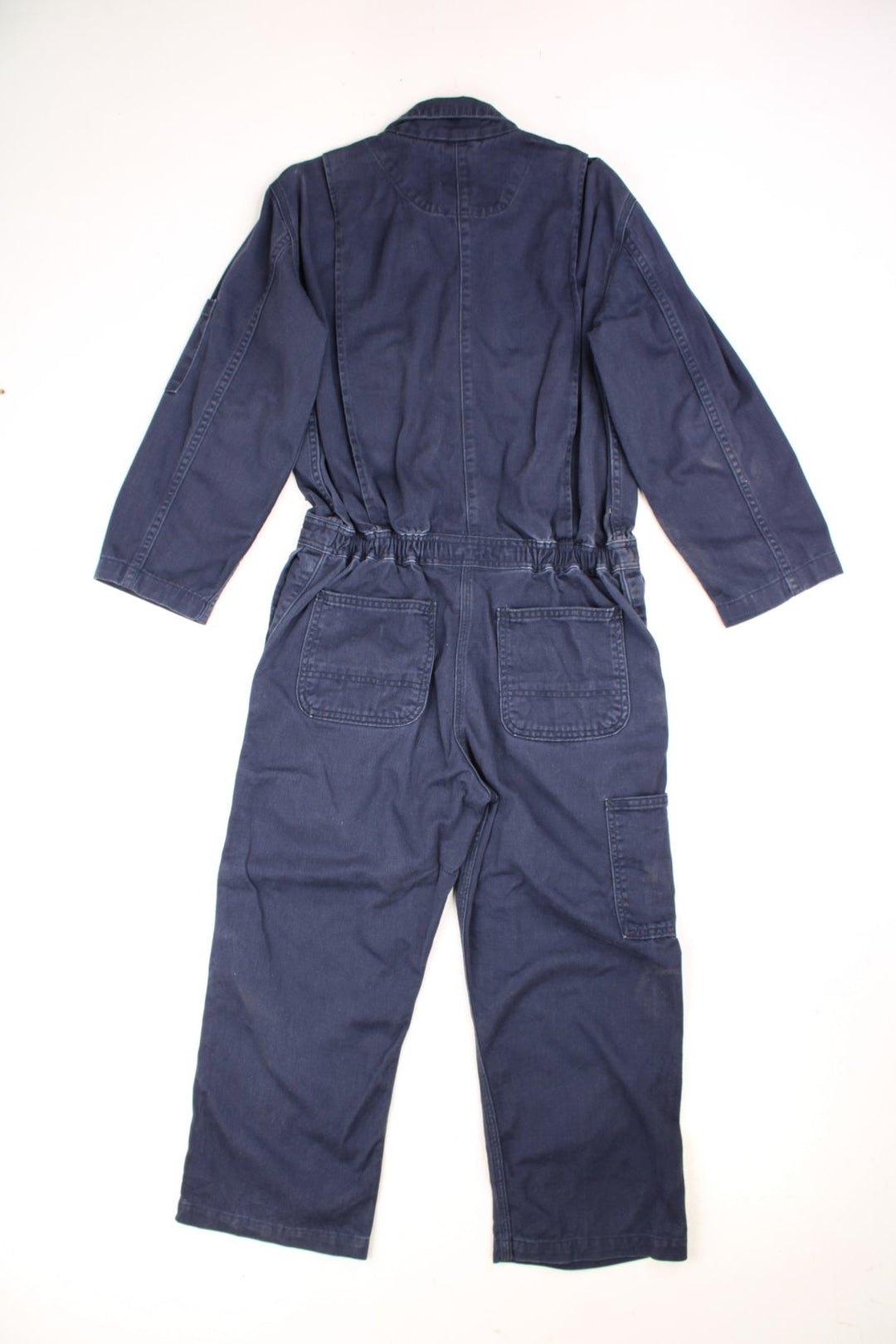 Vintage Carhartt Boiler Suit Overalls in a navy blue colourway, zip up with multiple utility pockets and has the logo embroidered on the chest. 