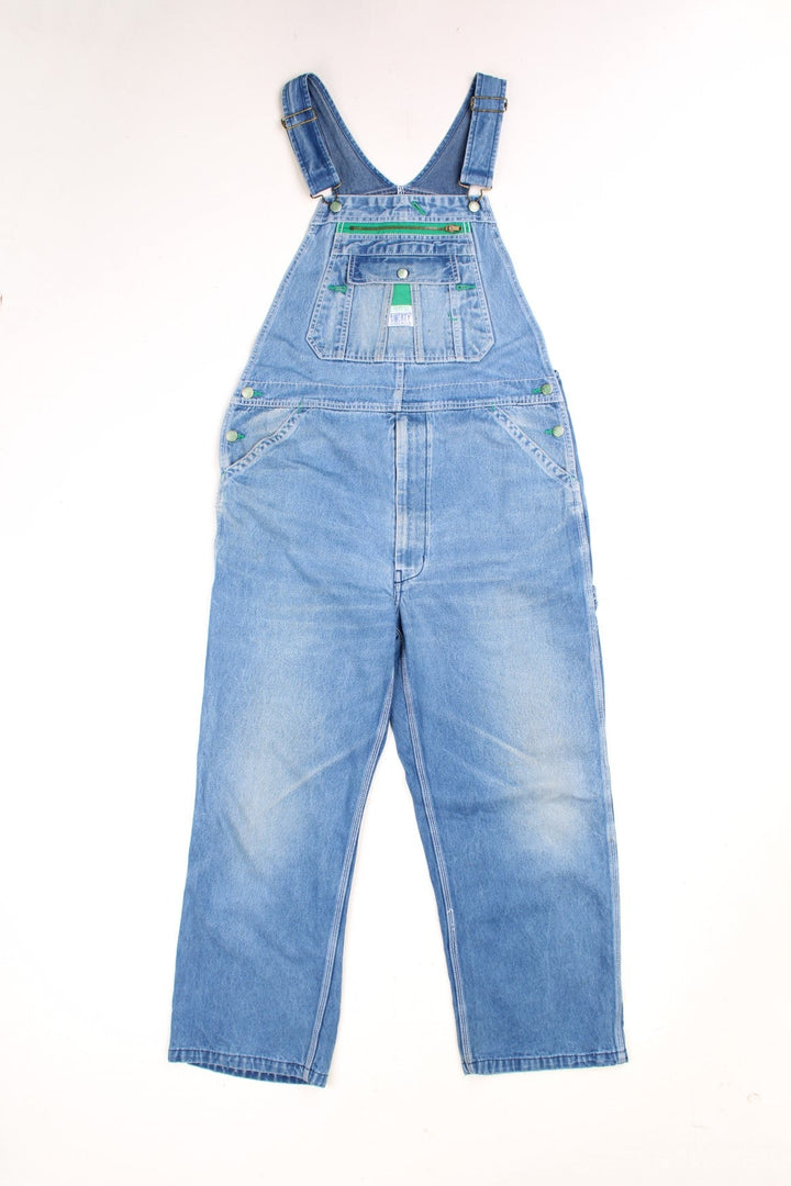 Liberty light wash denim dungarees with green accents, multiple pockets and a hammer loop. 