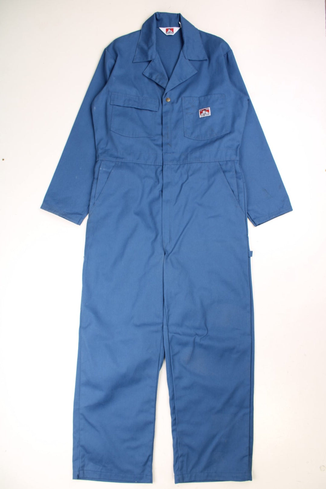 Ben Davies Boiler Suit Overalls in a blue colourway, zip up with multiple utility pockets and has the logo embroidered on the chest. 