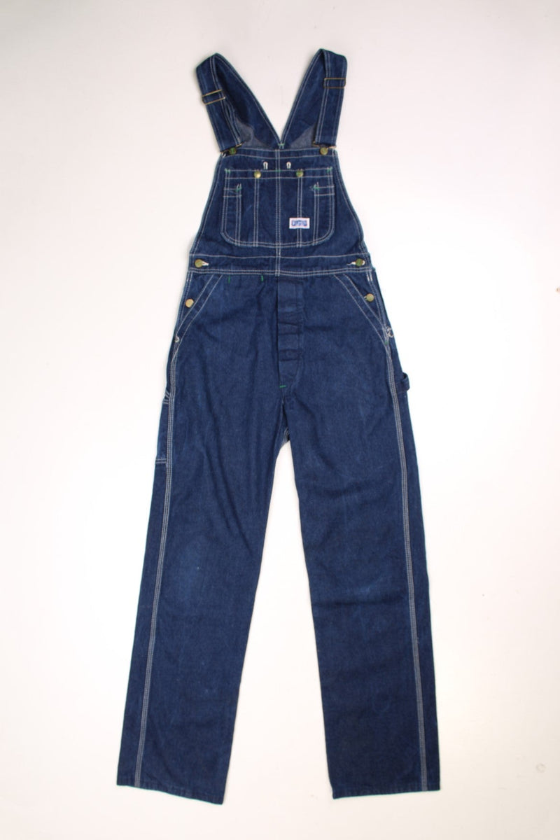 Vintage Big Smith dark wash dungarees with white contrast stitching, multiple pockets and a logo tab on the front and back. 