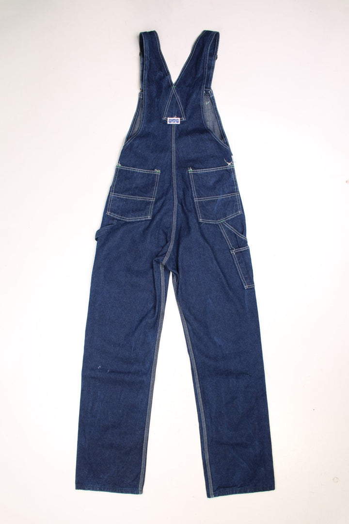 Vintage Big Smith dark wash dungarees with white contrast stitching, multiple pockets and a logo tab on the front and back. 