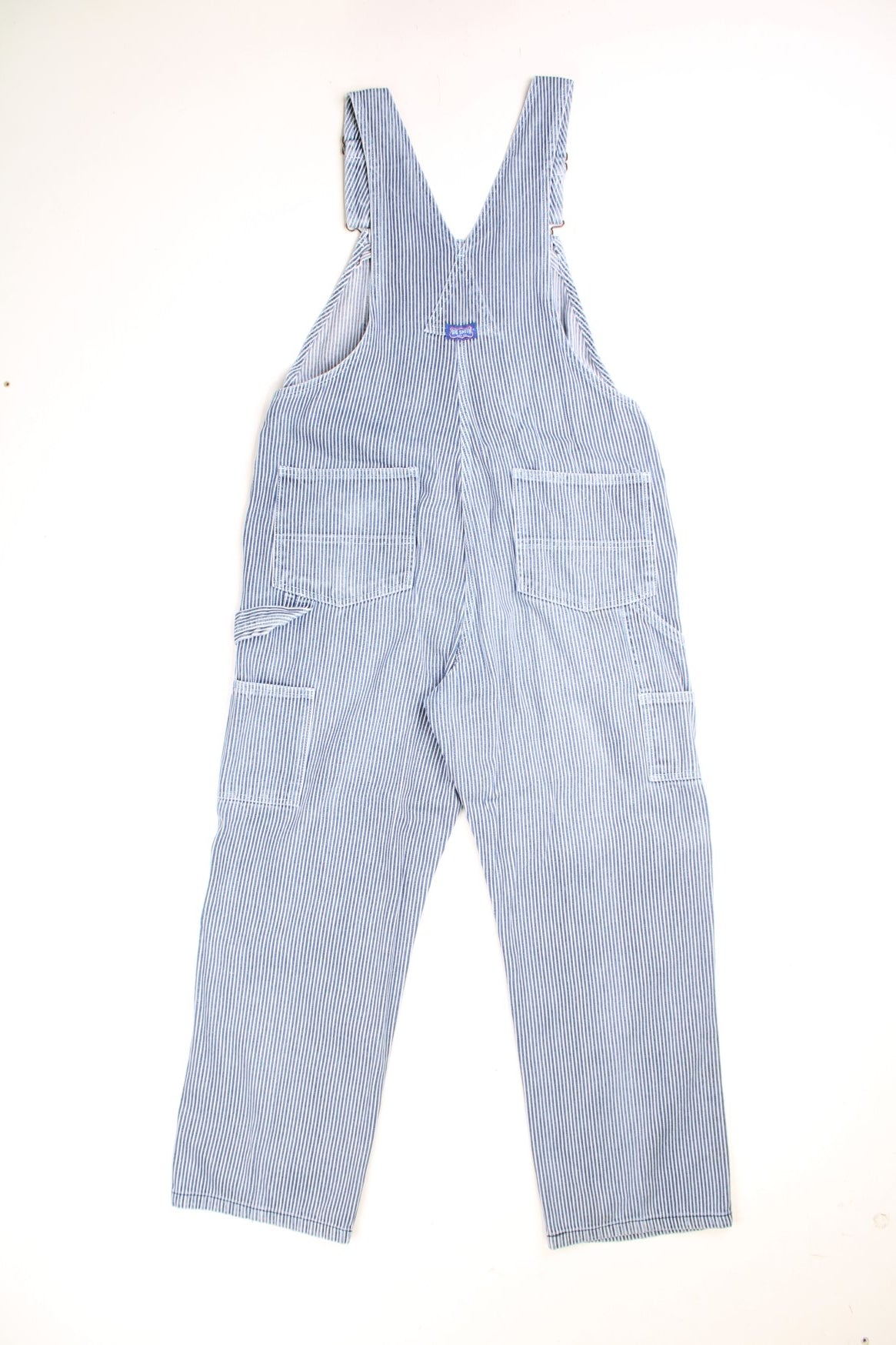 Big Smith Dungarees in a blue and white striped colourway with multiple utility pockets and the logo embroidered on the front. 