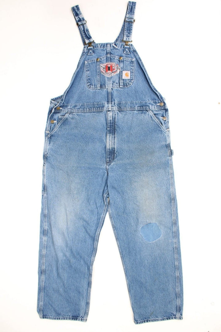 Vintage Carhartt denim bib overalls/dungarees with an Ohio Stadium embroidered badge. Features logo on the pocket.