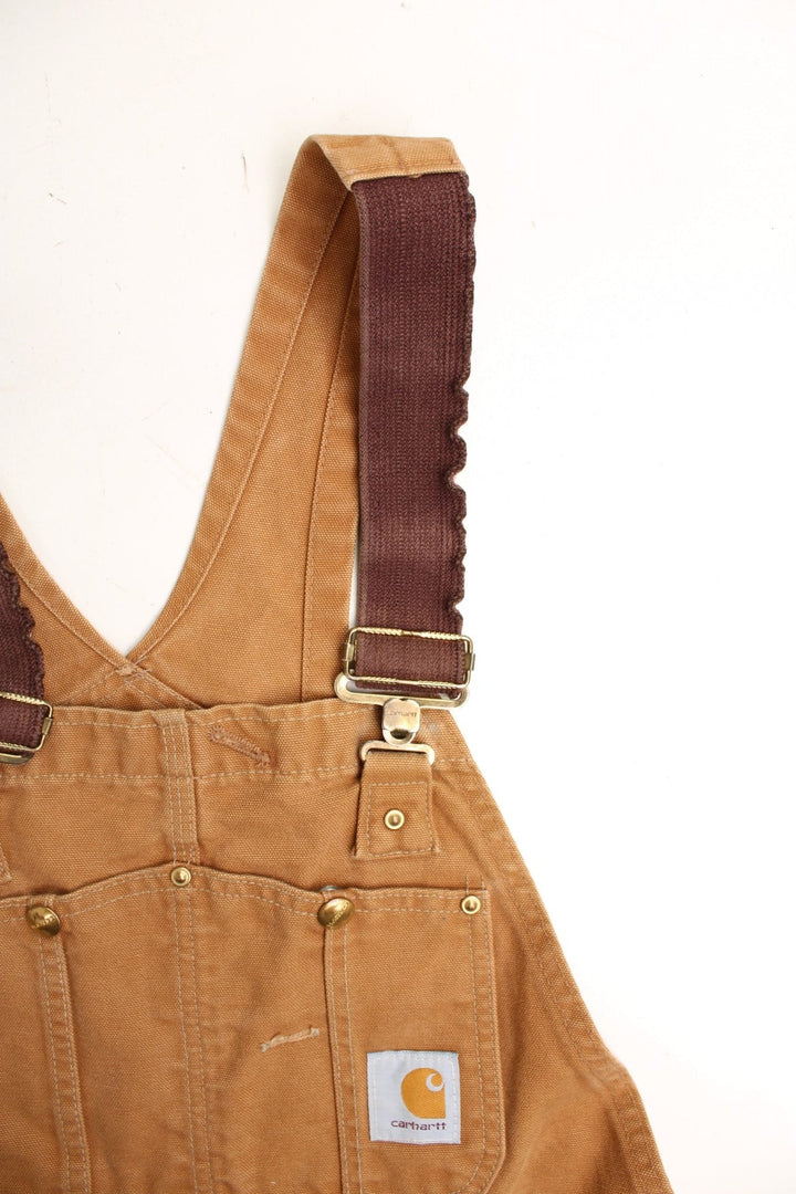 Carhartt double knee overalls/dungarees. Features multiple pockets and embroidered logo. 