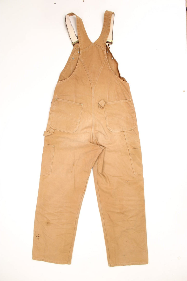 Carhartt double knee overalls/dungarees. Features multiple pockets and embroidered logo. 