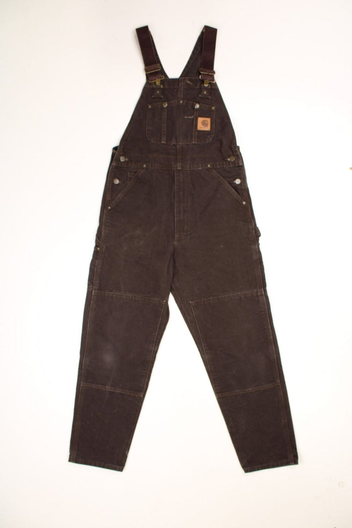 Vintage Carhartt double knee brown overalls/dungarees. Features multiple pockets and embroidered leather logo. 