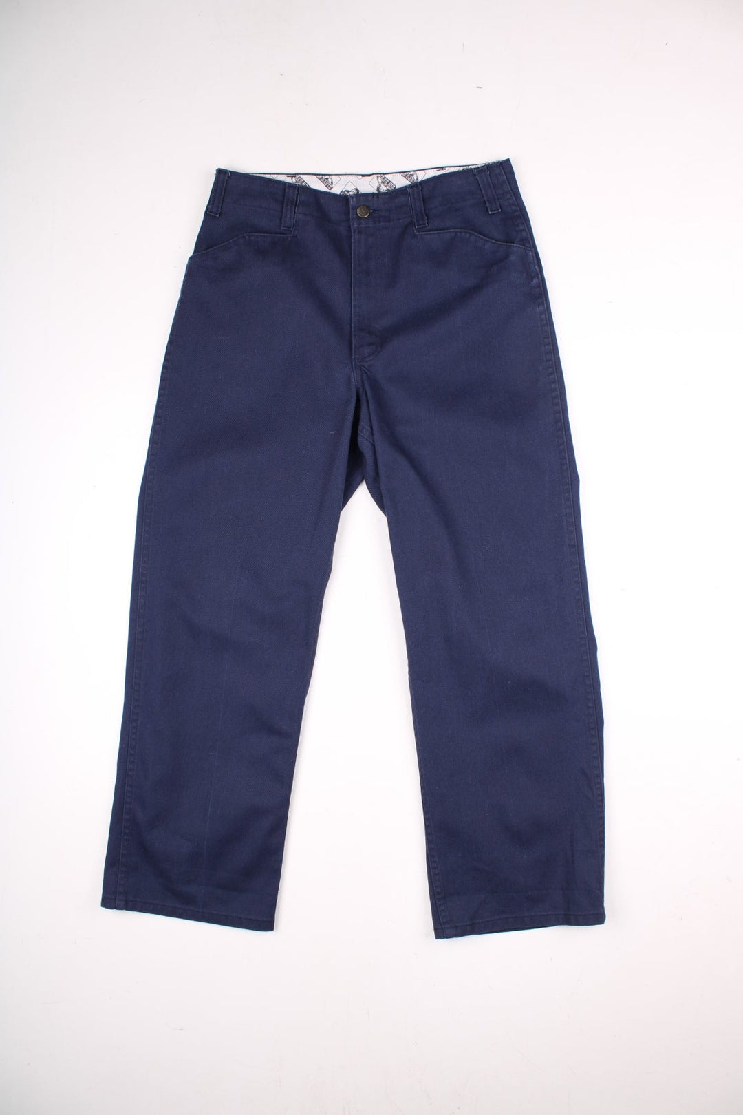 Ben Davis work trousers in navy blue with multiple pockets, zip and button closure, and a logo patch on the back pocket.