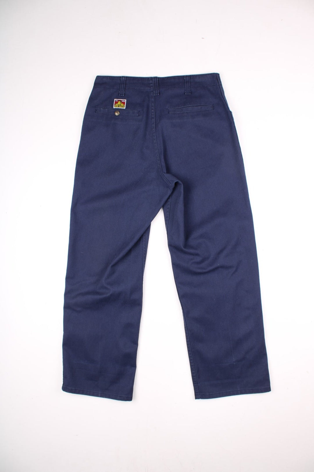 Ben Davis work trousers in navy blue with multiple pockets, zip and button closure, and a logo patch on the back pocket.