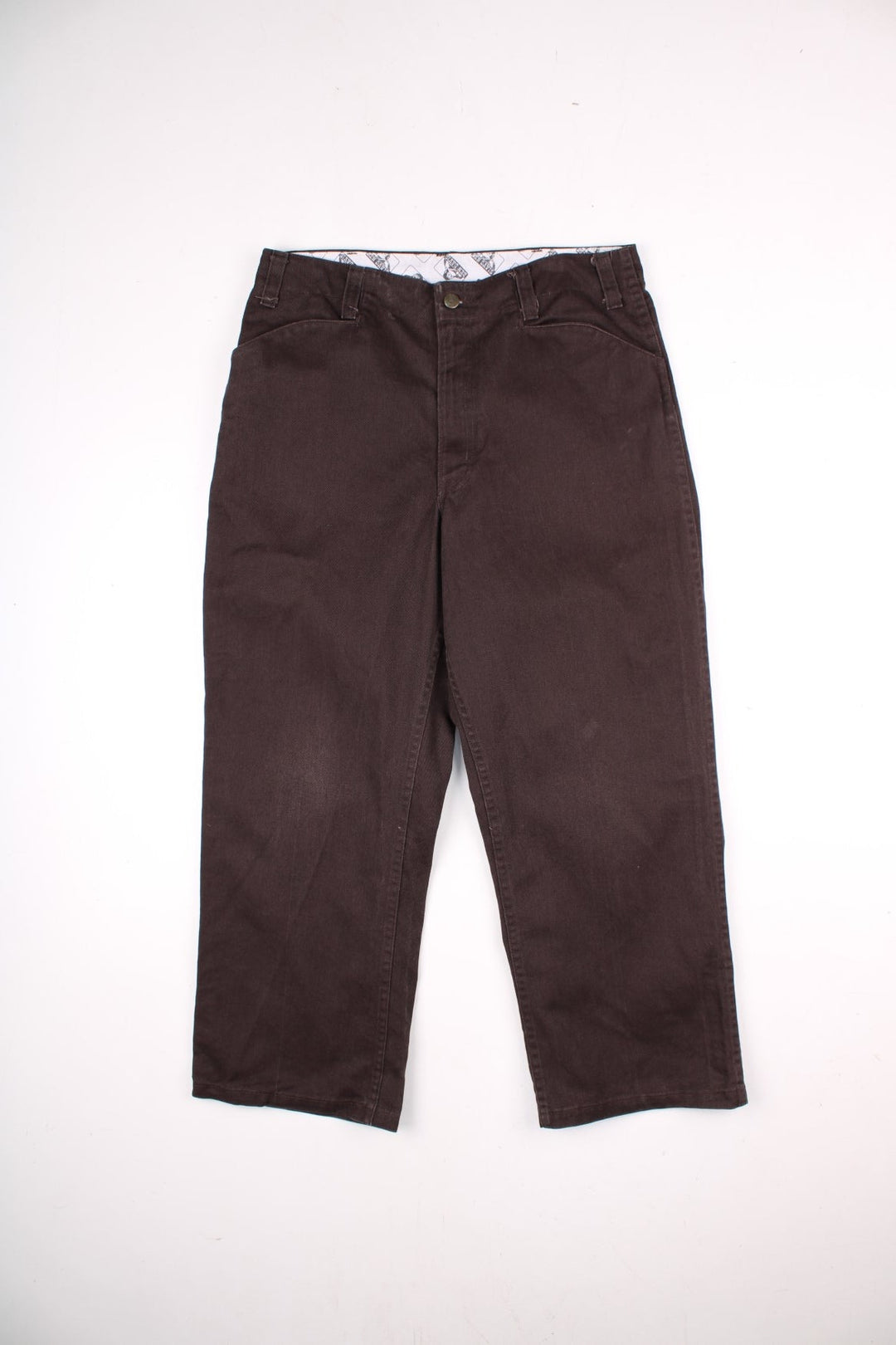 Ben Davis corduroy trousers in dark brown with multiple pockets, zip and button closure, and a logo patch on the back pocket.