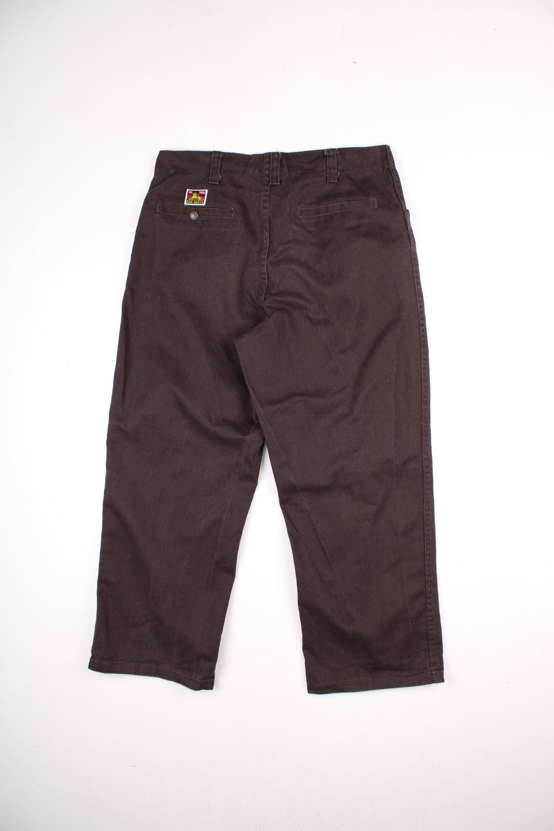 Ben Davis corduroy trousers in dark brown with multiple pockets, zip and button closure, and a logo patch on the back pocket.