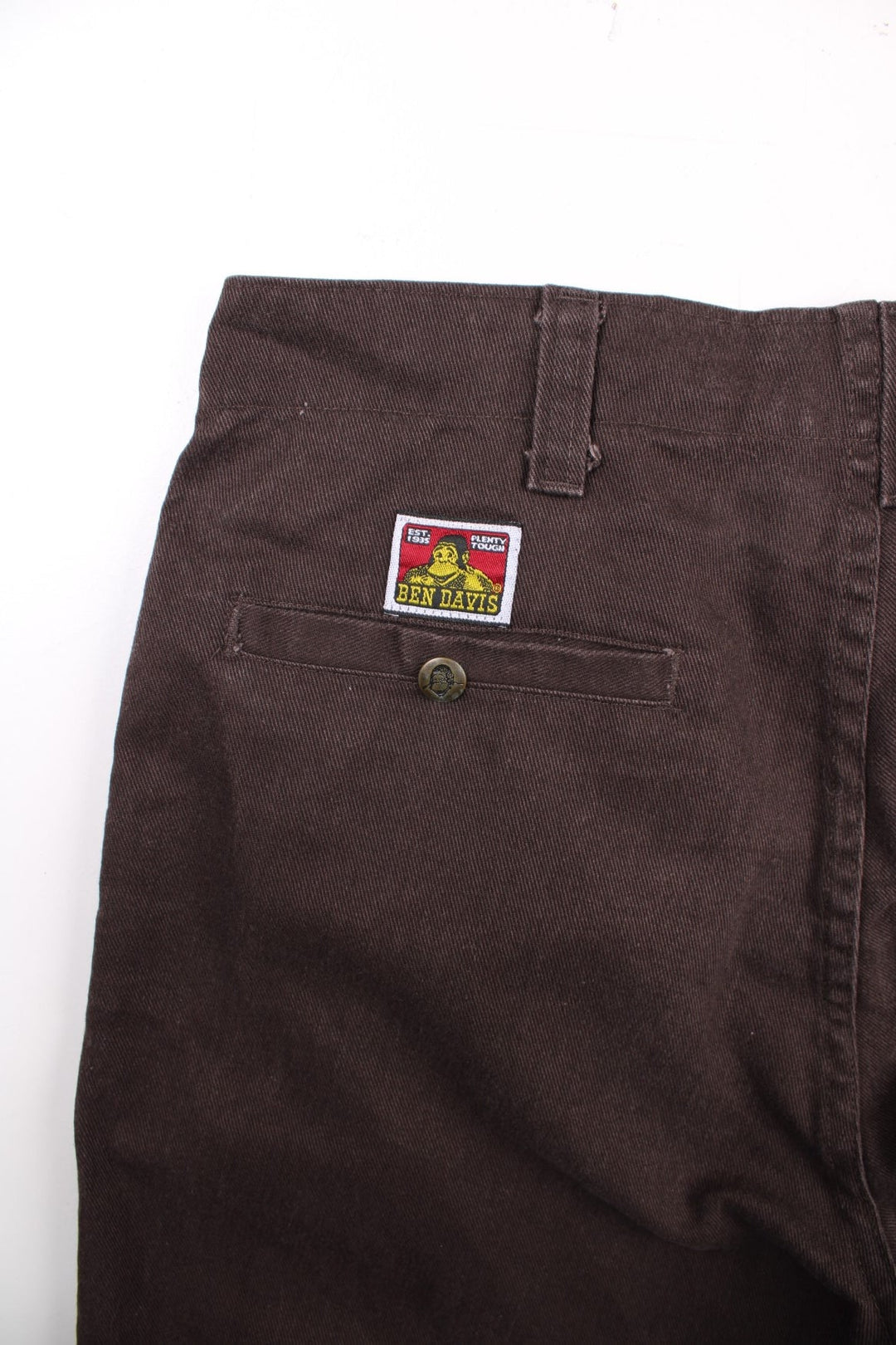 Ben Davis corduroy trousers in dark brown with multiple pockets, zip and button closure, and a logo patch on the back pocket.