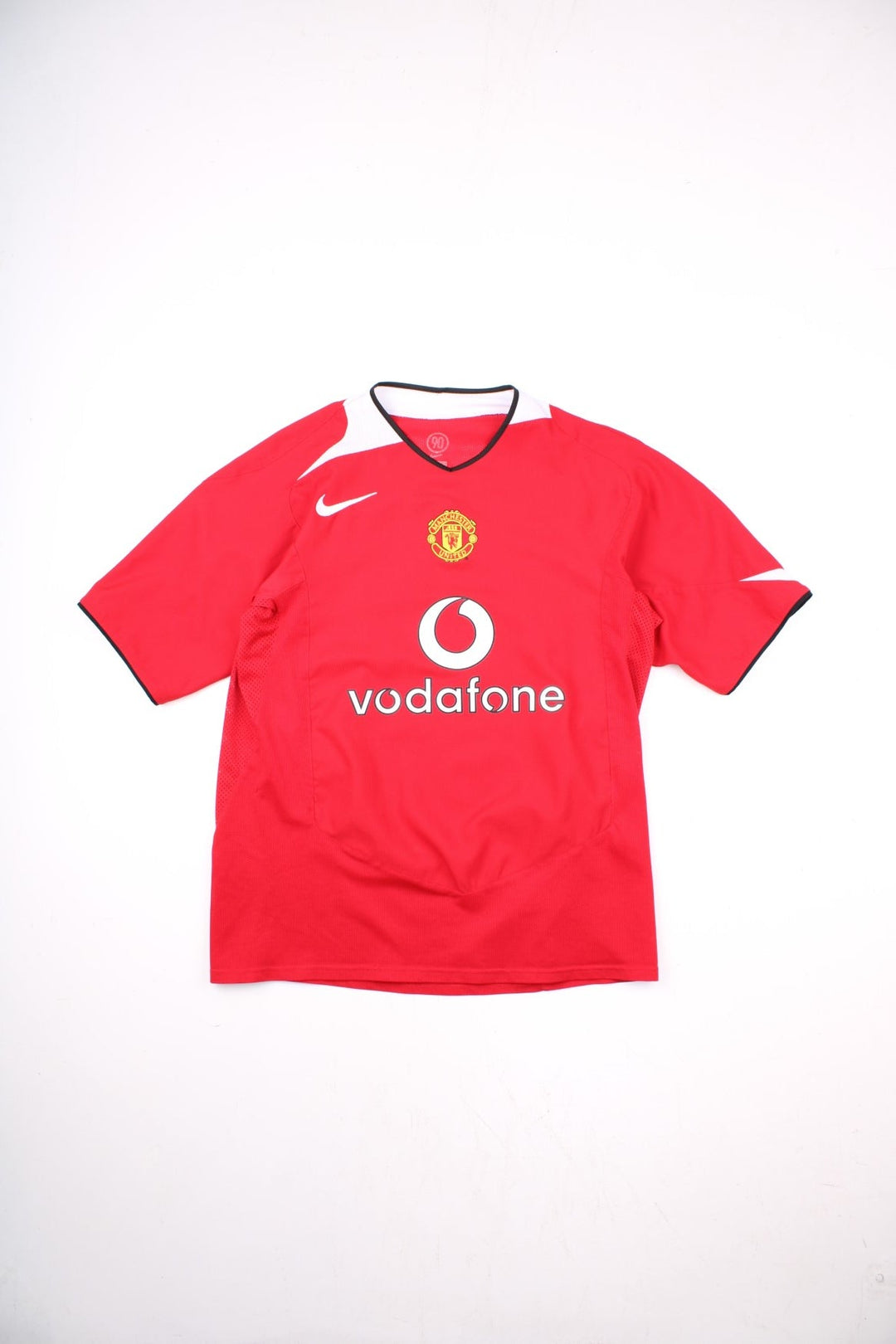 Manchester United 2004/06 Nike Football Shirt in the red home kit colourway, features embroidered logos and badge on the front.