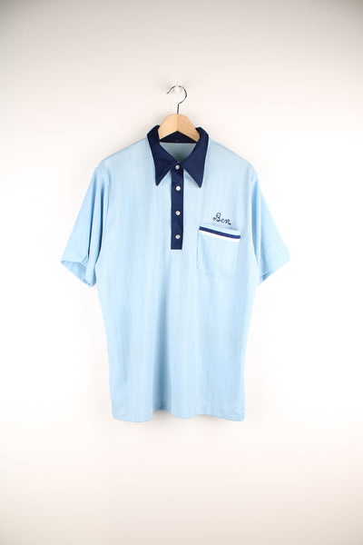 Vintage looks likes 60's/70's blue tone nylon polo style bowling shirt with dagger collar and chain stitch spell-outs on the front and back