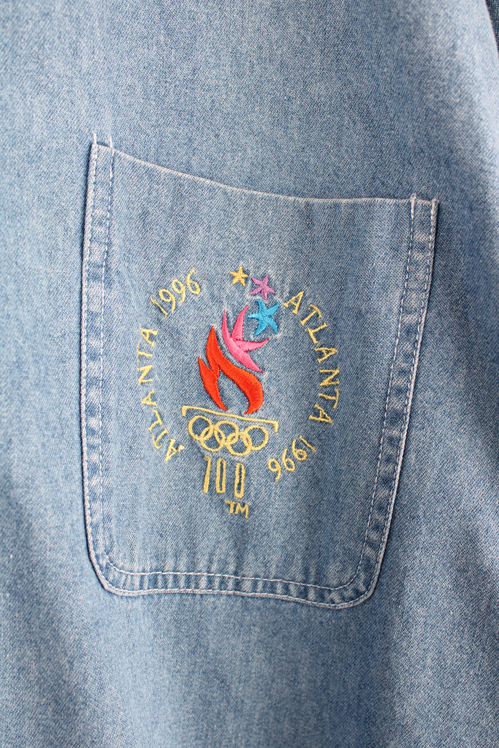 Vintage 1996 Atlanta Olympics denim button up shirt with embroidered graphic on the front pocket 