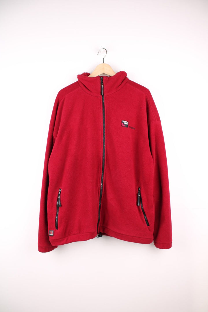 Spray Way 'windbloc' zip-through fleece in red with two zipped side pockets and a Polartec logo badge on the lower left hem, and a logo patch on the back of the collar. 