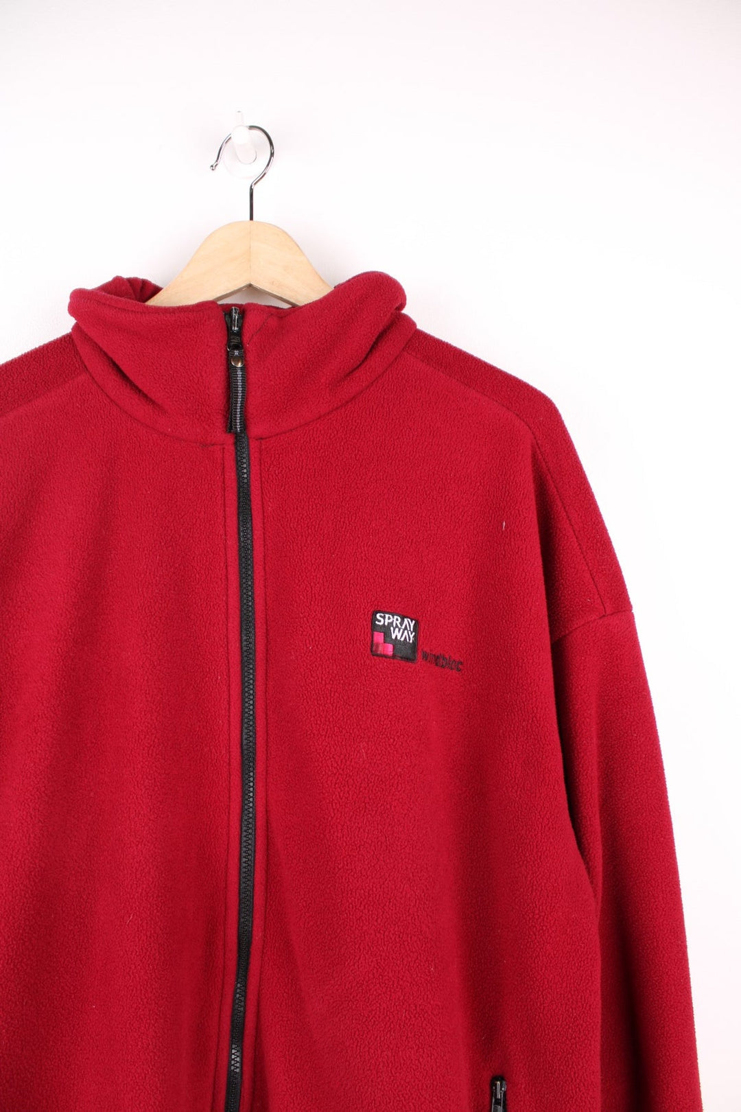 Spray Way 'windbloc' zip-through fleece in red with two zipped side pockets and a Polartec logo badge on the lower left hem, and a logo patch on the back of the collar. 