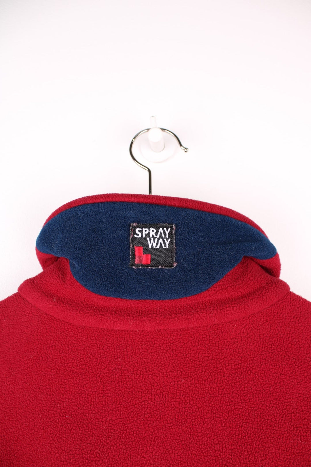 Spray Way 'windbloc' zip-through fleece in red with two zipped side pockets and a Polartec logo badge on the lower left hem, and a logo patch on the back of the collar. 