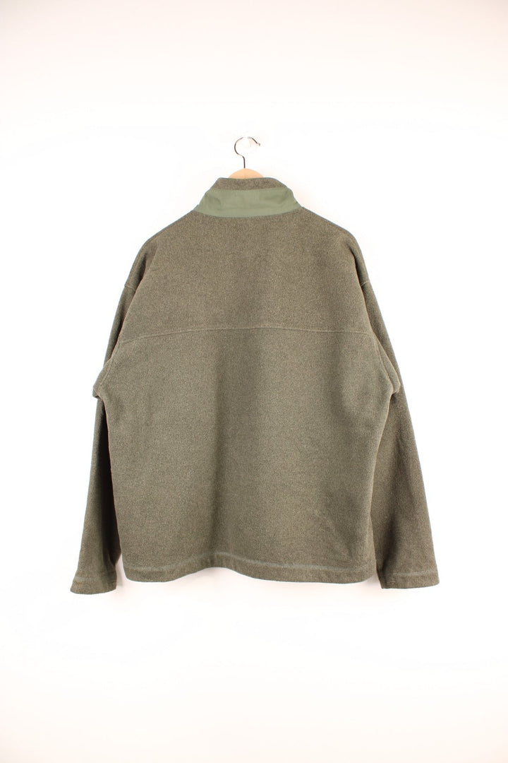 Dark green Patagonia Synchilla zip-up fleece with one zipped pocket with a branded zip-pull.   